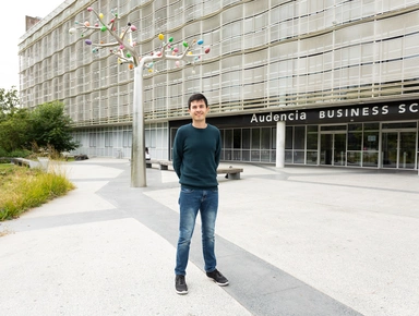 Summer Term student standing in front of Audencia Atlantic Campus