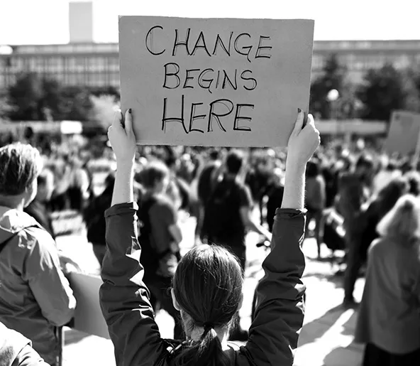 Audencia - Young woman brandishing a placard during a demonstration