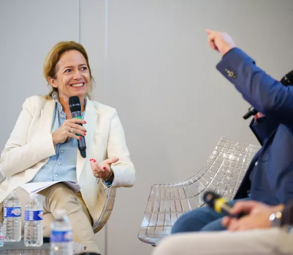 Audencia professor speaking at a conference microphone