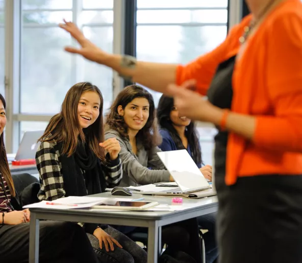 Teacher in front of a group of female students